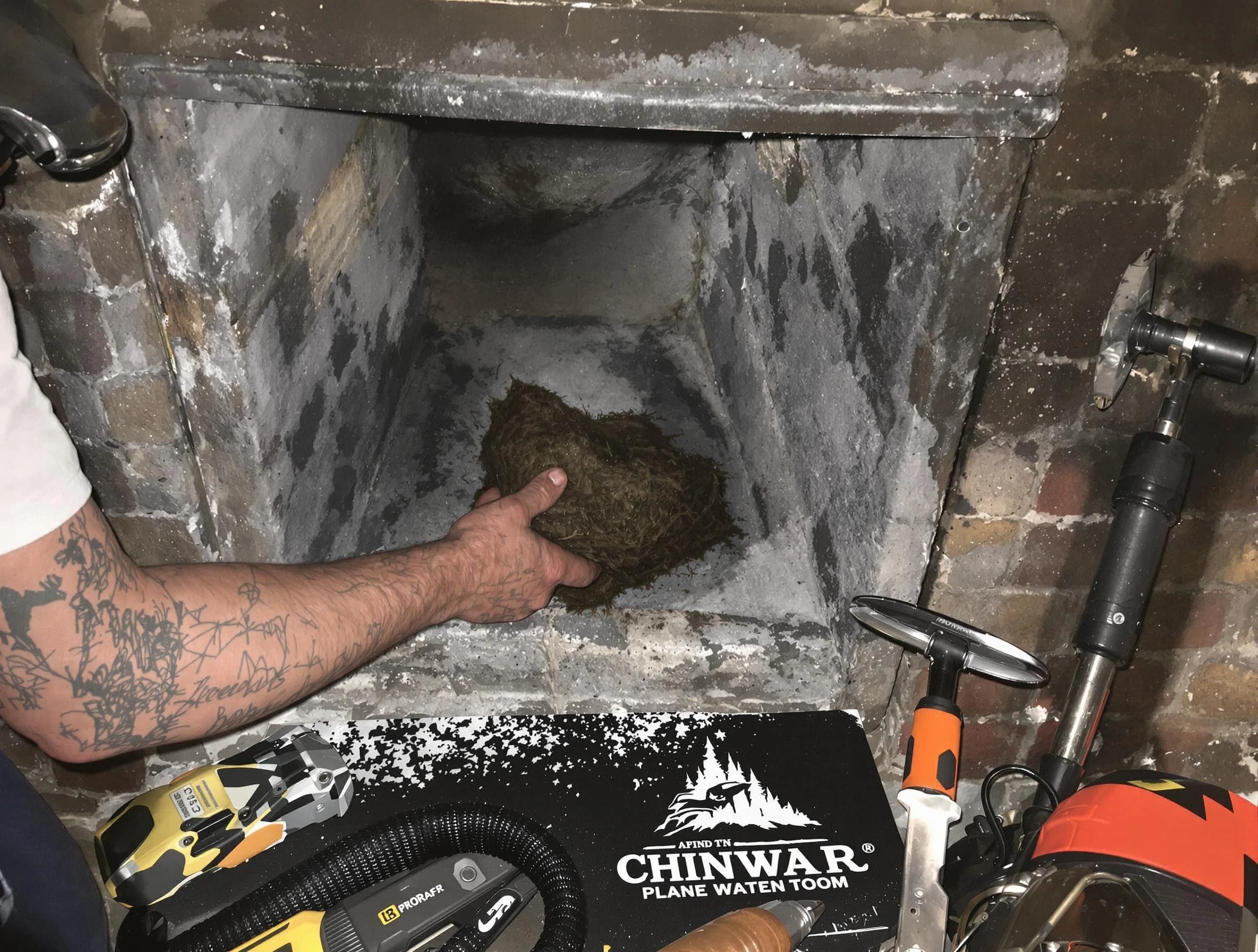 Cumberland Chimney Sweep safely removing debris and screening chimney in Cumberland, RI