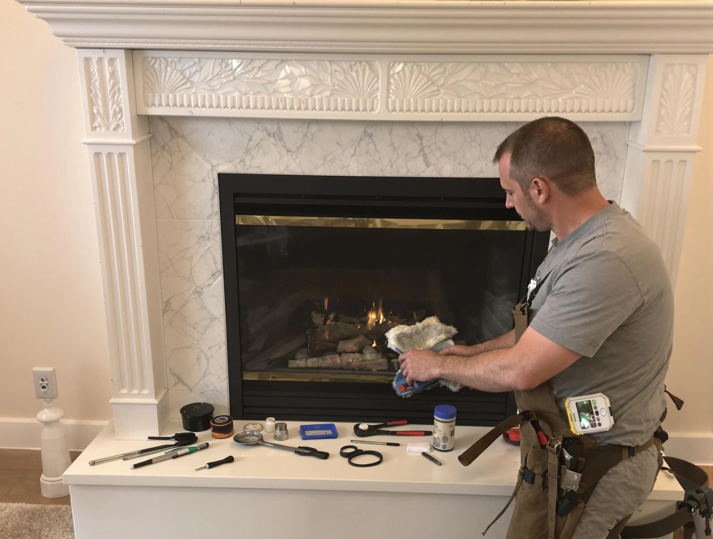 Cumberland Chimney Sweep performing fireplace maintenance in Cumberland, RI